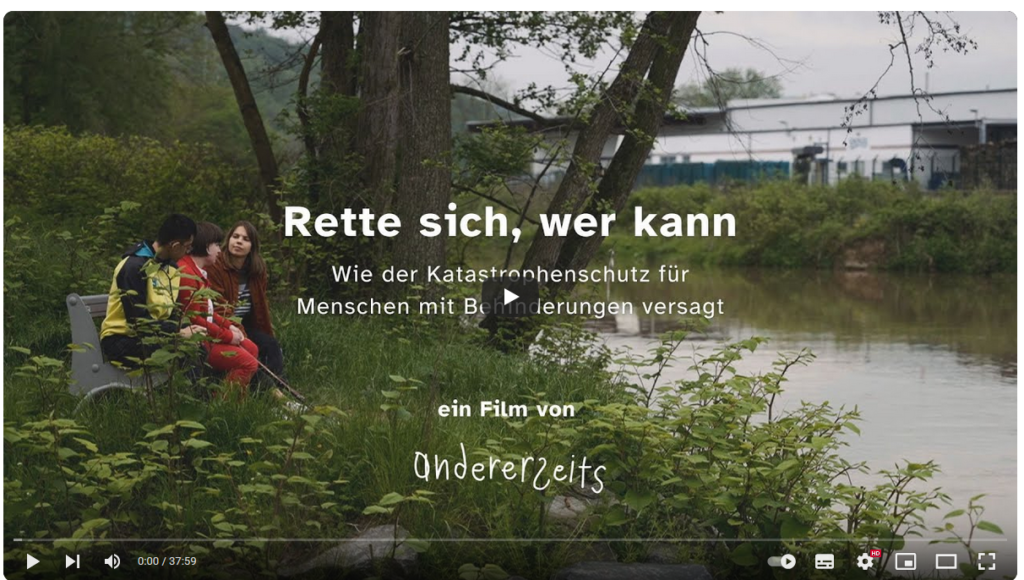 Screenshot of Youtube Title of the Film with people crouching at a river