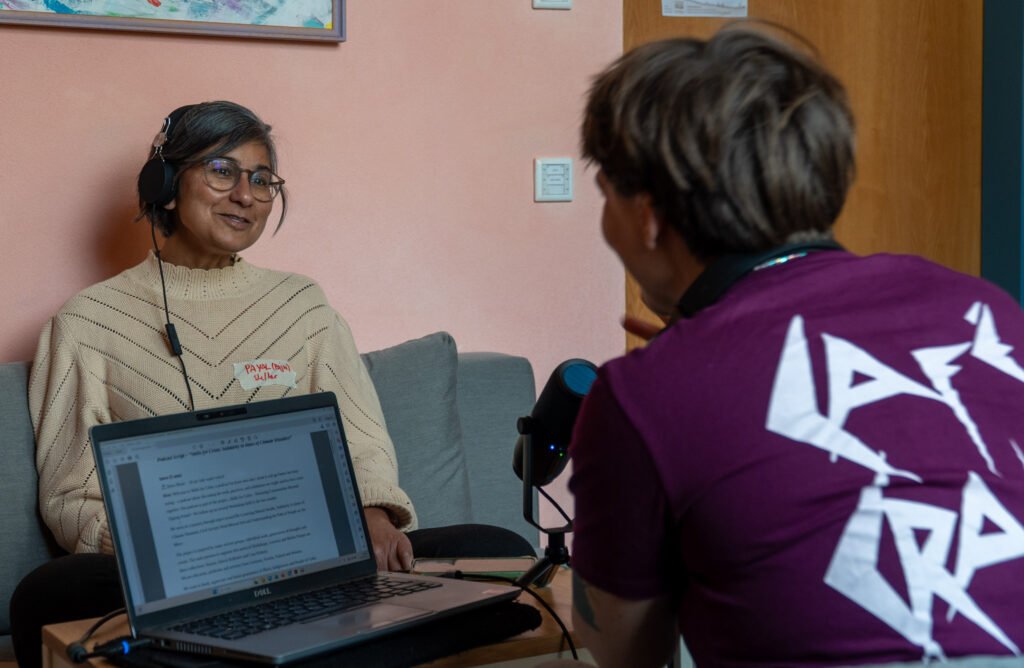 Two people in a podcast set-up.